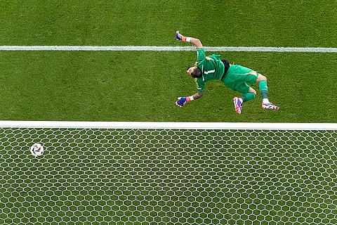 Italy's goalkeeper Gianluigi Donnarumma fails to safe a shot